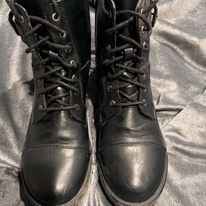 Black boots man made material.  Worn.  Women size 8 mens size 6